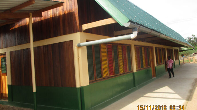 image: handing akwidaa school to community