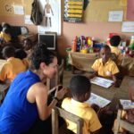 image: Dr Sharon chatting with a child