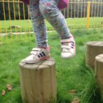 image: stepping on balance beam