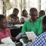 The OLA trainers practice some scenarios they may face in the screening process