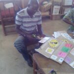 A parent enjoying making some weather puzzles