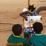 KG2 children sharing a story outside