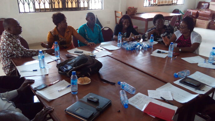 The trainers plan their delivery for the last top up training workshop