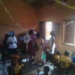 Image: trainers coaching a teacher