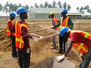 Site staff sieving fine aggregate
