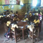 image: KG children working at table