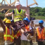 volunteer thomas being lifted by site team
