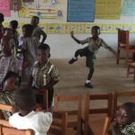 image: children laying in classroom at Holy Child KG