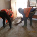 image: site team sweeping